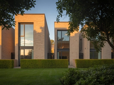 Symmetrical architectural capture of aluminium tilt & turn windows across an entire building facade, modern UK office complex
